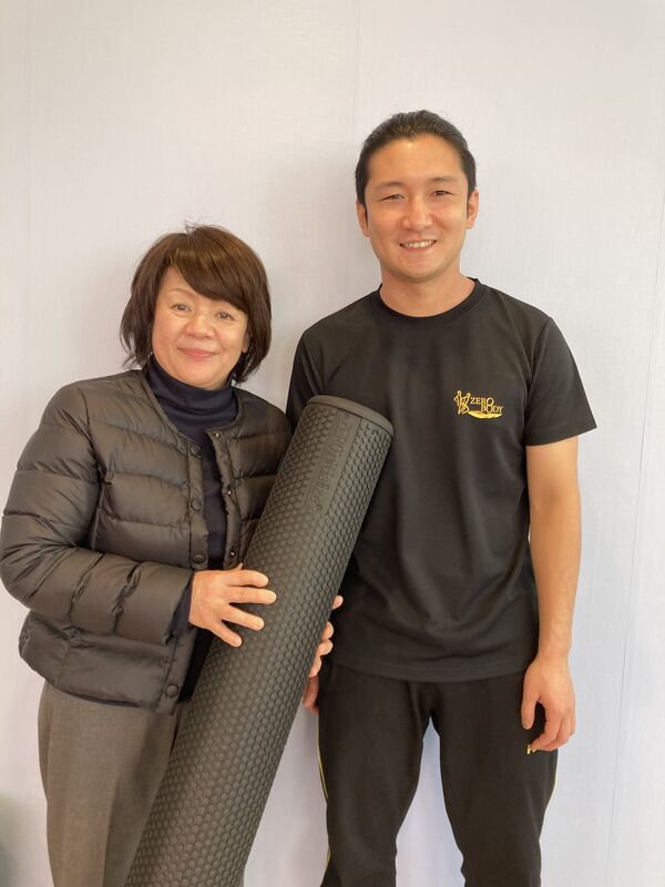 ポールを手にしたタムラさんと院長